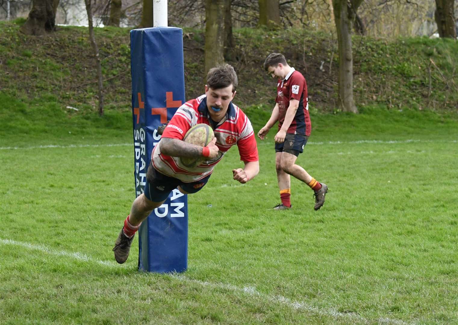 Connor McWilliam scores Moray's ninth and final try. Picture: James Officer