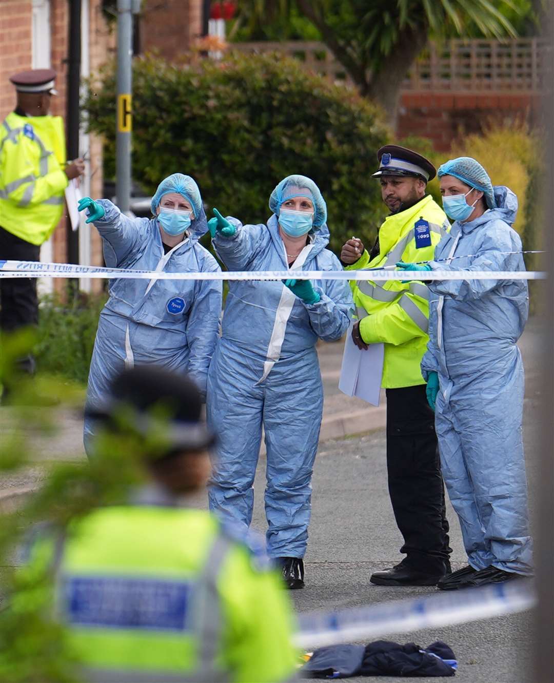 Forensic investigators in Laing Close in Hainault, north-east London (Jordan Pettitt/PA)