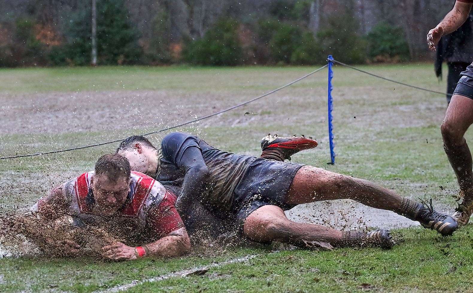 Lewis Scott is driven into touch with a big splash. Picture: John MacGregor