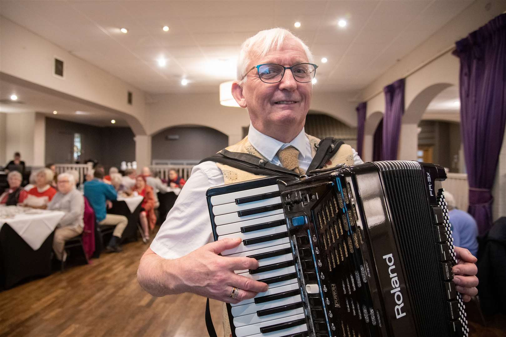 Ken Walker played the accordion at the event. Picture: Daniel Forsyth.