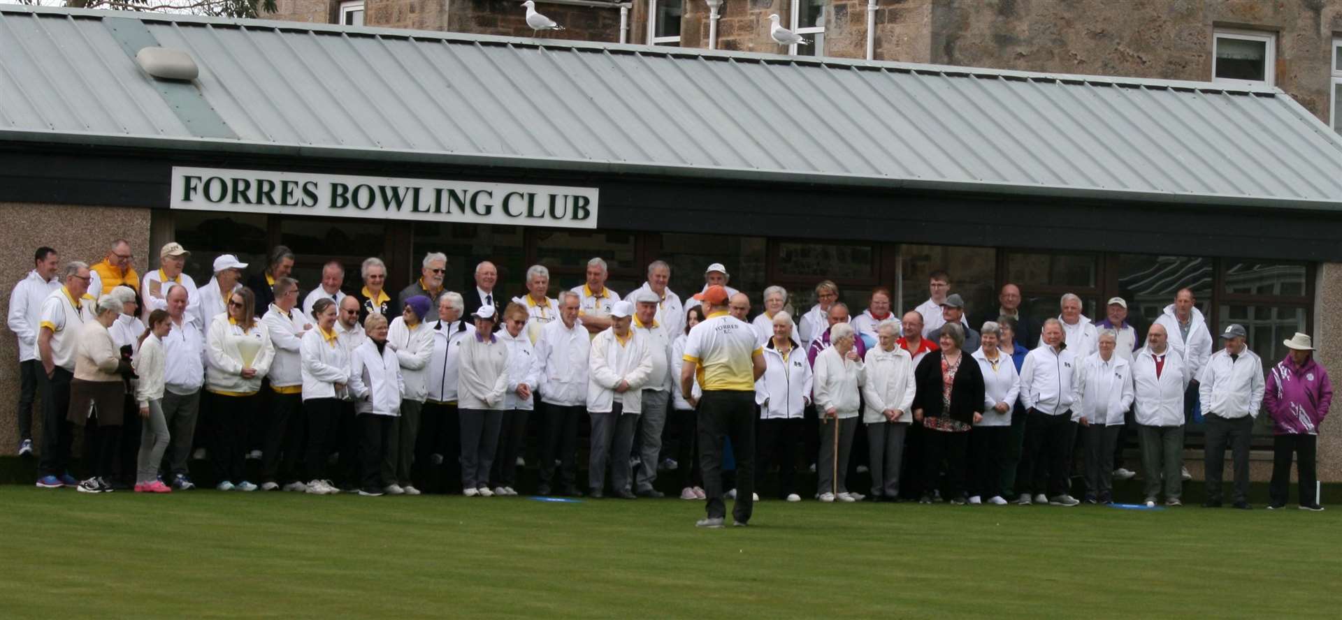 Members get ready for the first action on the Forres bowling green.