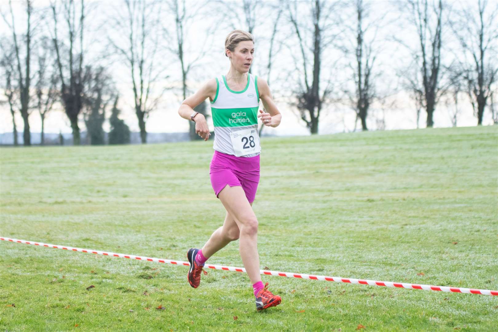 Gala Harriers' Sara Green (#28) out ahead on her way to first overall in the race...scottishathletics National Masters Cross Country Championships at Grant Park, Forres February 11 2024...Picture: Daniel Forsyth..
