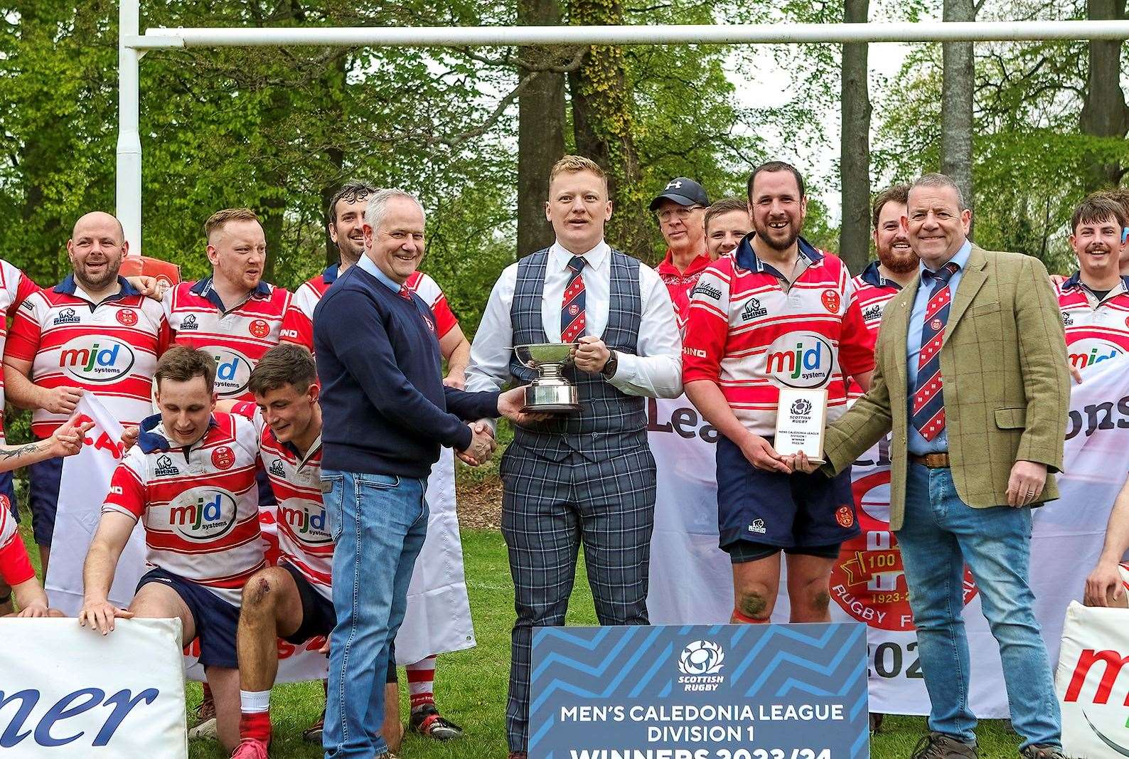 Captain Lewis Scott being presented with Division 1 trophy by Mark Dunscombe. President Fraser Andrews and John Westmacott display the winners' plaque. Picture: John MacGregor