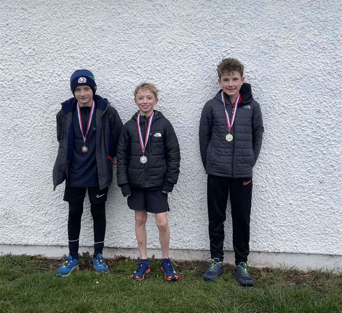 P6/7 boys winner Fraser Heron (right), second-placed Finn Carruthers (centre) and third-placed Jacob Forward.