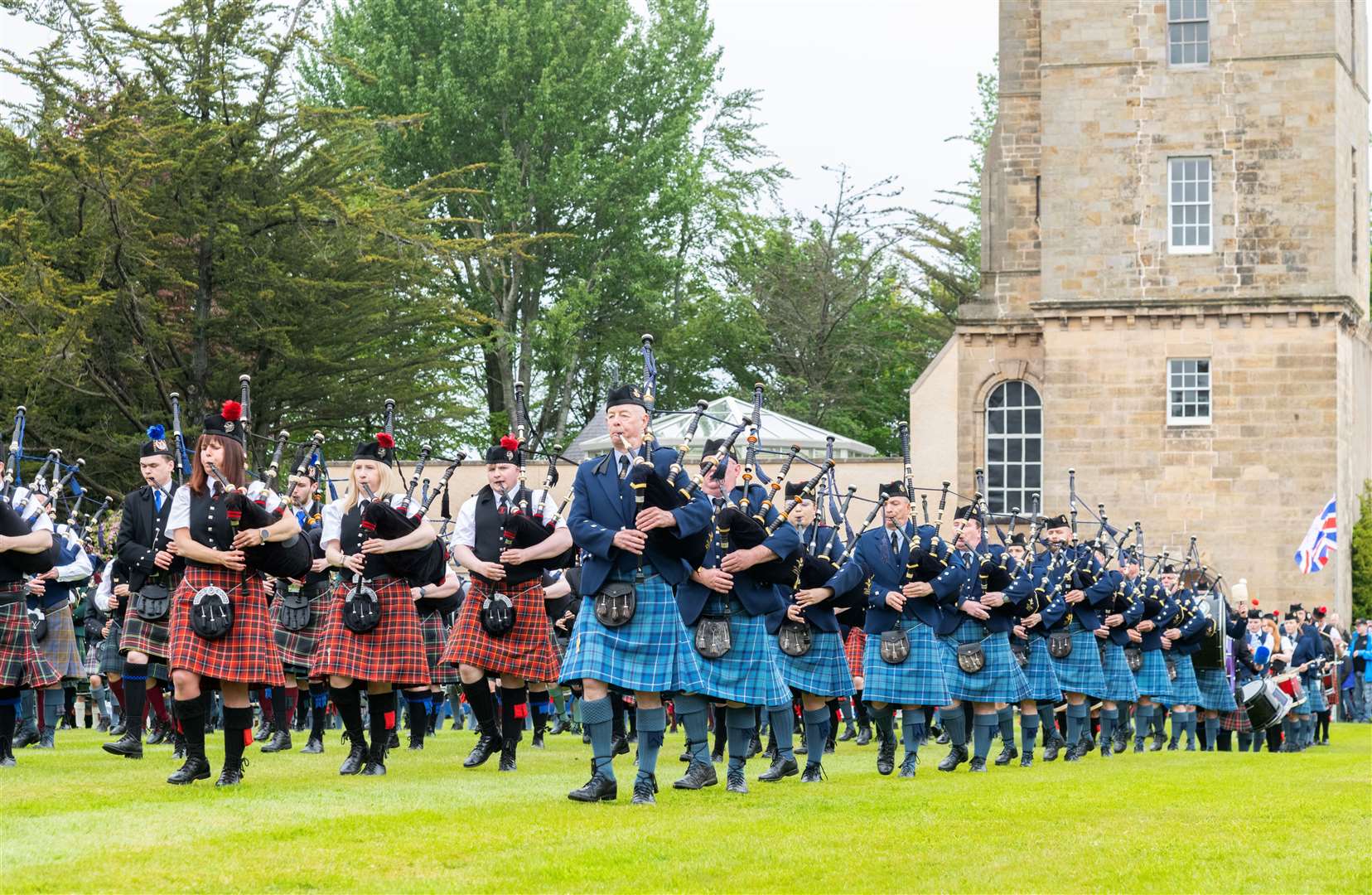 Massed pipes and drums marching in the Country Sports Arena make for a splendid sight at the Gordon Castle Highland Games 2023. Picture: Beth Taylor