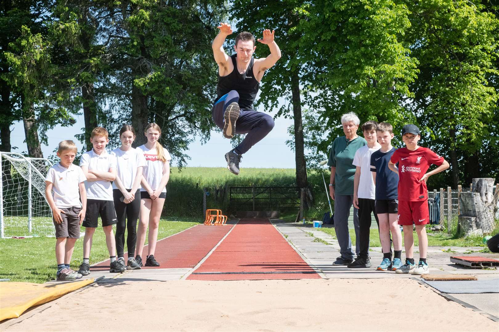 Knockando athletics coach Margery Swinton watches fellow coach Kyle Wilkinson on the village’s runway. Picture: Daniel Forsyth