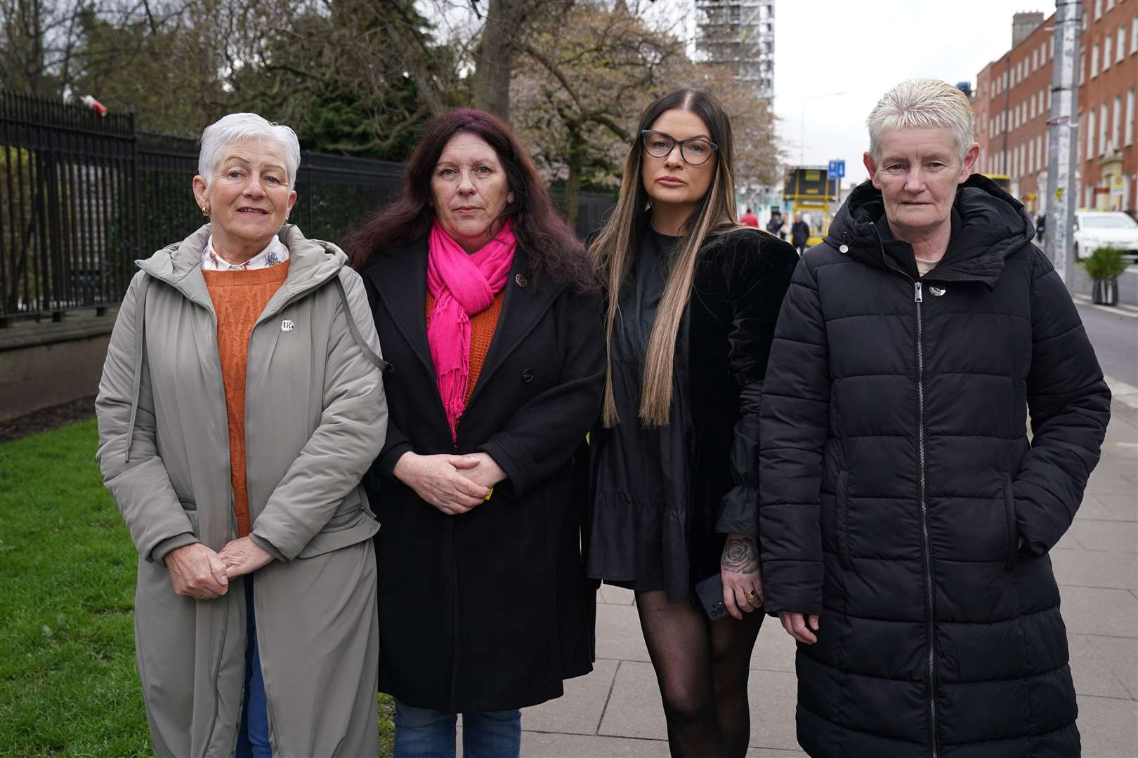 Friends, supporters, and family of those lost people in the blaze, outside Dublin Coroner’s Court (Brian Lawless/PA)