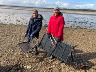 Kathleen Munro and Carla Horsnby collected broken chairs during the Findhorn litter pick.