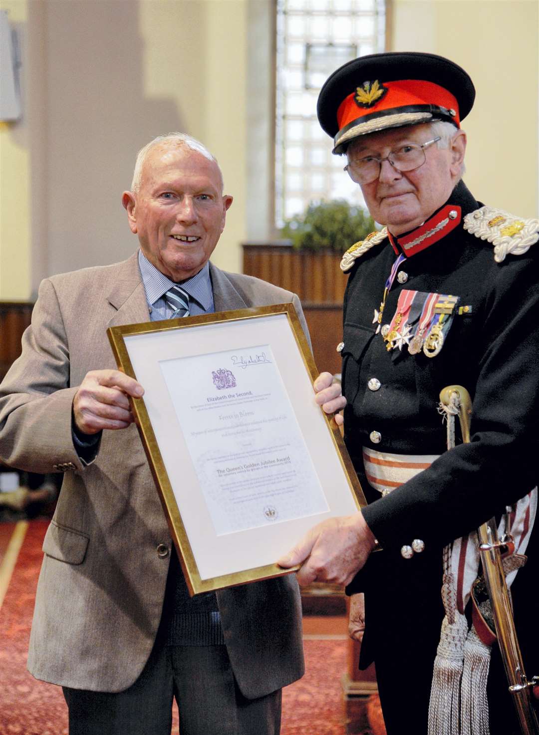 Bert accepting the Queen's Award on behalf of Forres In Bloom from Lieutenant Colonel Grenville Shaw Johnston.