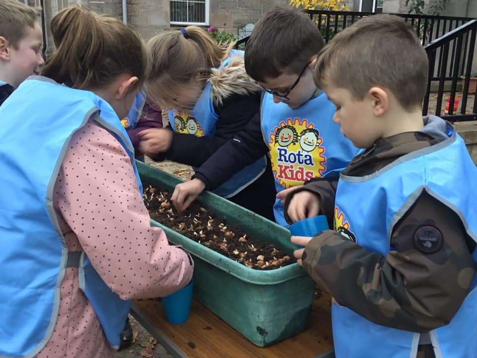 Anderson’s Primary Rotakids planting out a grow tub.
