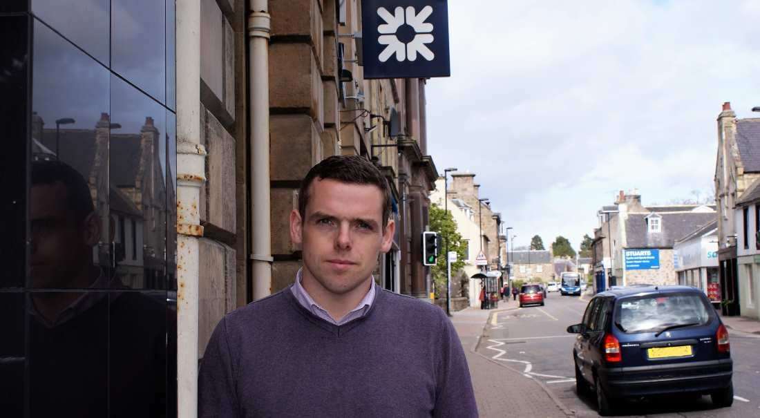 Douglas Ross MP outside the building that housed the local branch of Royal Bank of Scotland.