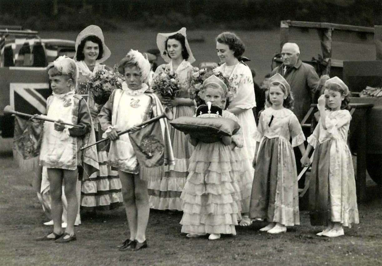Forres Gala Queen Evelyn Keil about to be crowned at Grant Park, July 16, 1947. The ladies in waiting are Joyce Wright and Cathie Cameron. The buglers are Rex McIntosh and Norman McIvor. From Rev Alan Smith's collection.