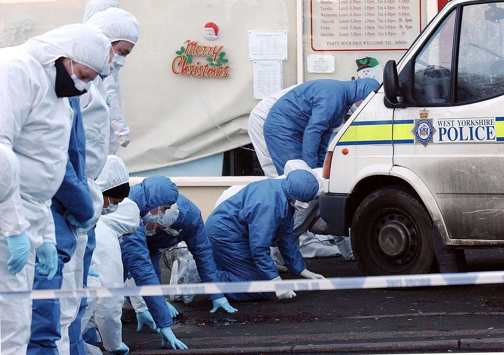 Forensic officers search the scene after the 2003 murder in Dib Lane, Leeds (John Giles/Archive/PA)