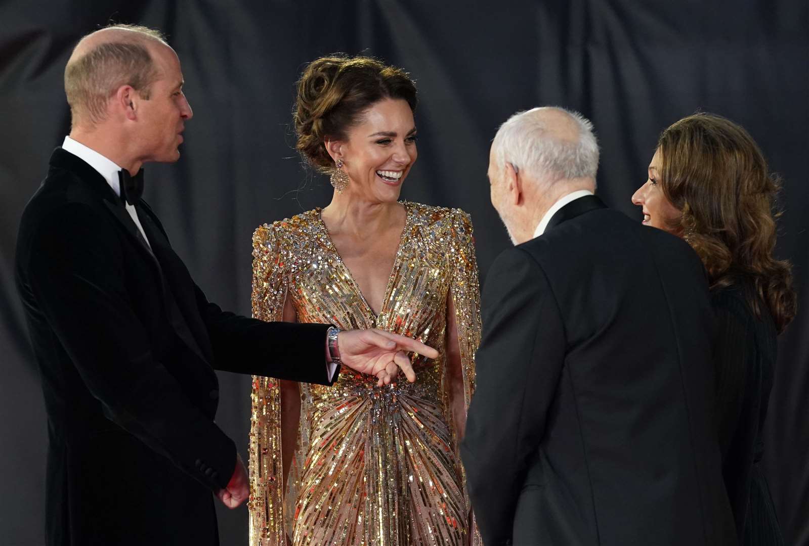 The Duke and Duchess of Cambridge are greeted by Bond producers Barbara Broccoli and Michael G Wilson (Broccoli/PA)