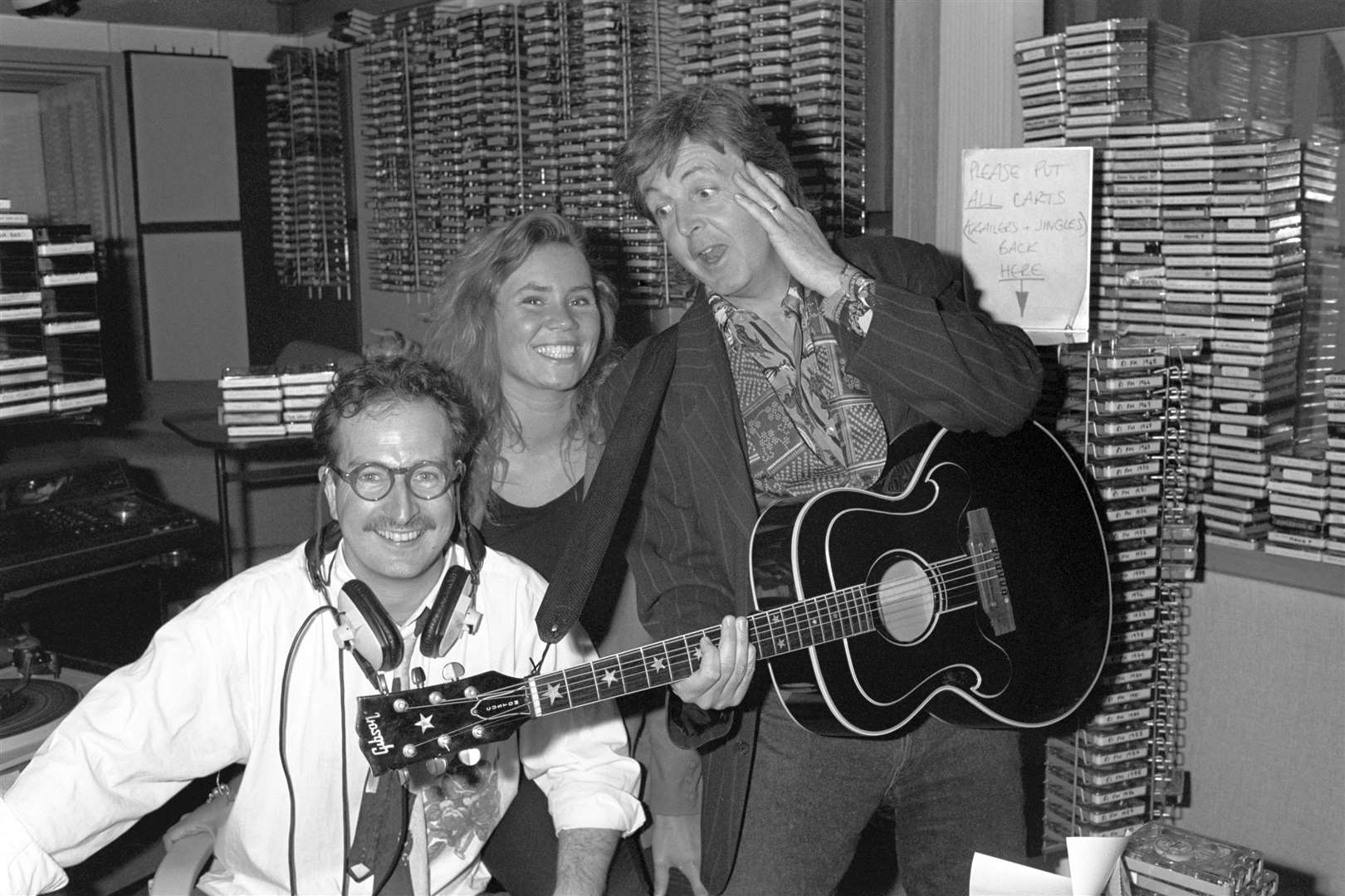 Paul McCartney surprising Radio 1 DJ Steve Wright and his production assistant Dianne Oxberry (PA)