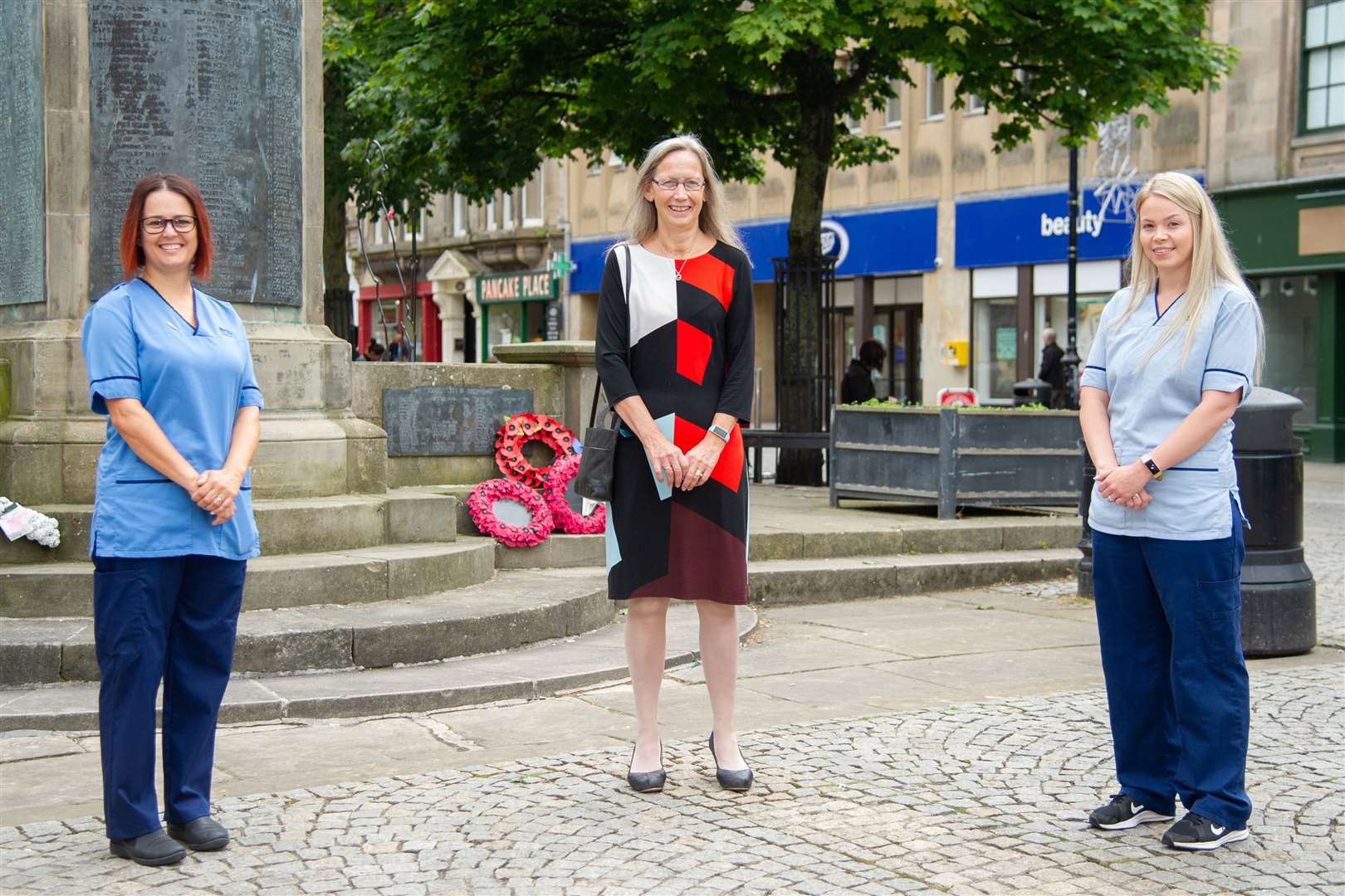 Niki Duncan, Liz Tait and Becky Hutchison, from Dr Gray's Hospital, at the Plainstones in Elgin to commemorate the 75th anniversary of VJ Day. Picture: Daniel Forsyth.