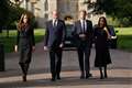 William and Harry united in grief as they meet well-wishers with their wives