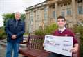 Teen gives cash raised for dream trip to Dr Gray's
