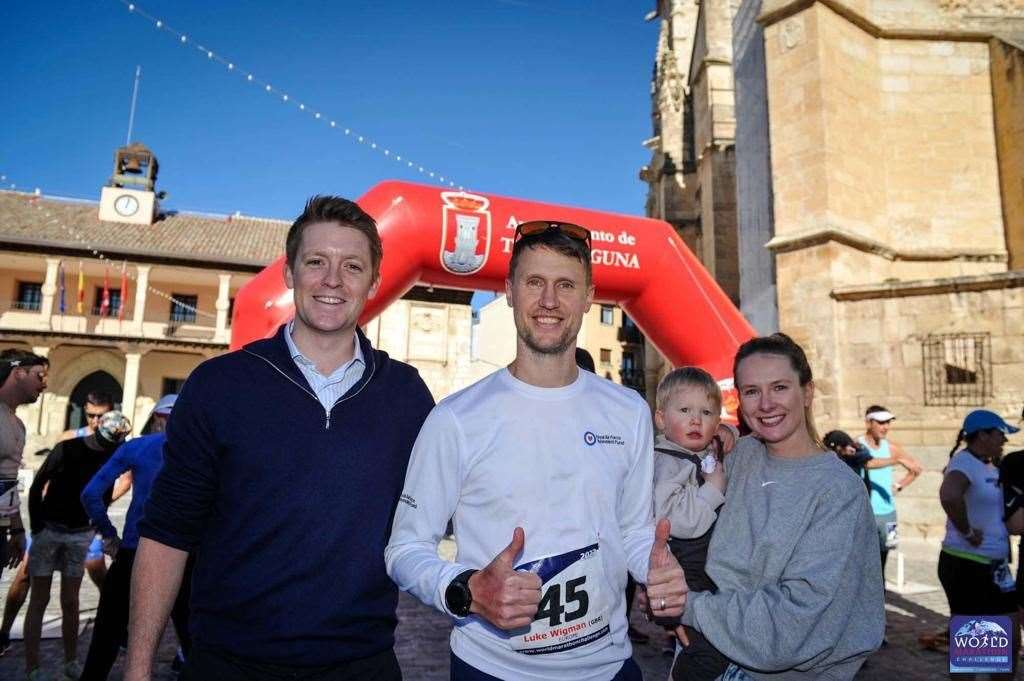 Mr Wigman arrived home to his wife, Nikki, and their two-year-old son Wilf on Wednesday (World Marathon Challenge/PA)