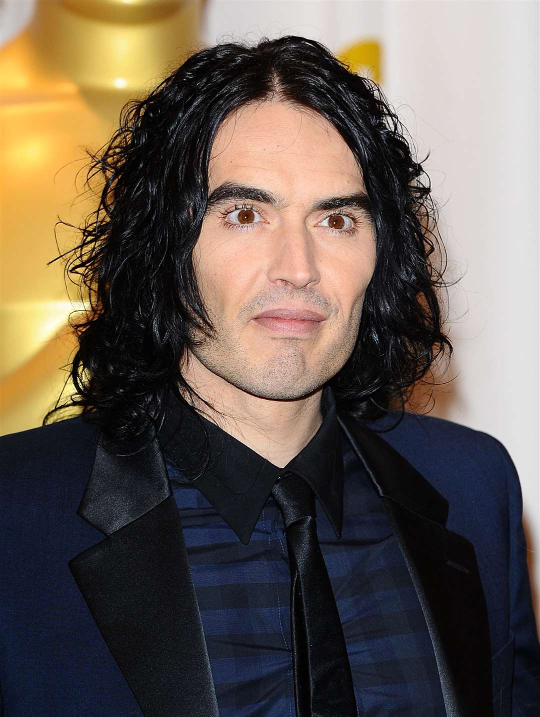 Russell Brand has denied allegations of sexual assault (Ian West/PA)