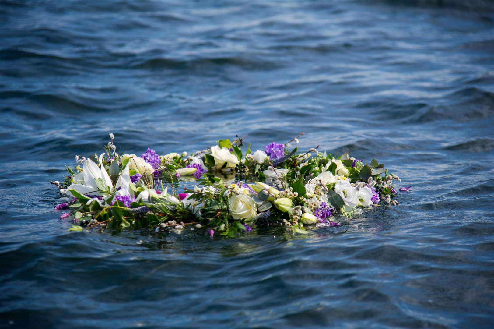 Gordonstoun sailors cast a wreath into the Moray Firth as the culmination to a week of tributes to former pupil Prince Philip. Picture: Becky Saunderson.
