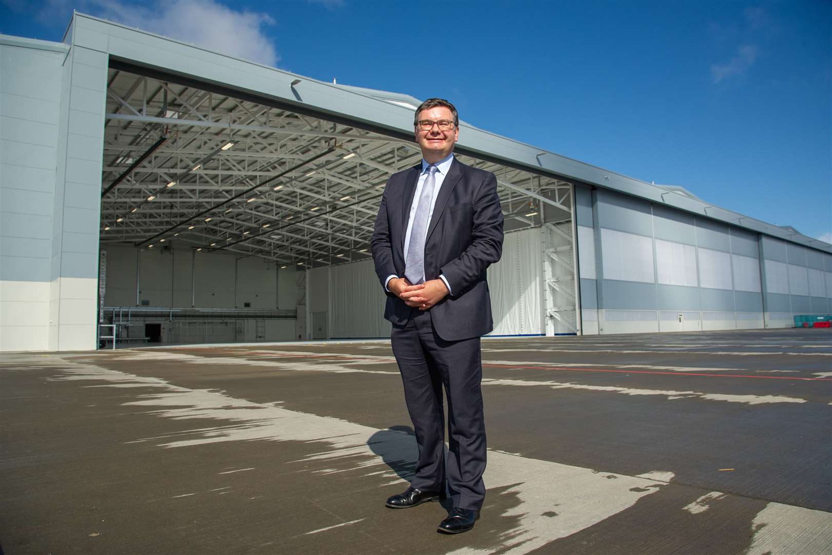 Iain Stewart, the Minister for Scotland, pictured this morning in front of the newly-built hangers for the Poseidon P-8A at RAF Lossiemouth Picture: Daniel Forsyth.