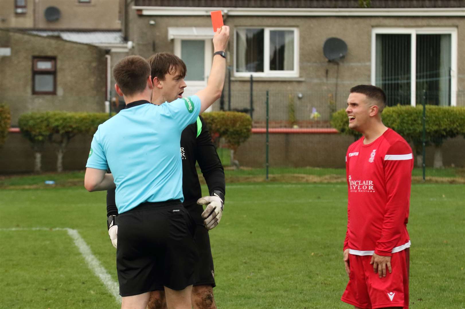 Forres Thistle keeper Dan Mcleod is shown the red card. Picture: David Porter