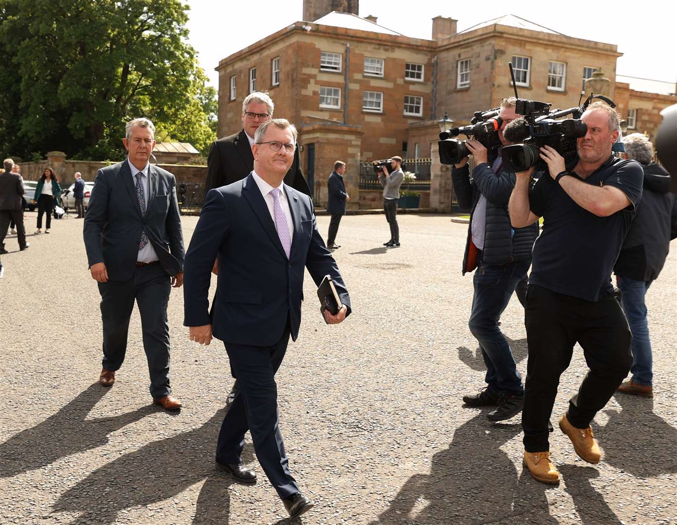 DUP leader Sir Jeffrey Donaldson (centre), leaves Hillsborough Castle after holding talks with the Prime Minister on Monday (Liam McBurney/PA)
