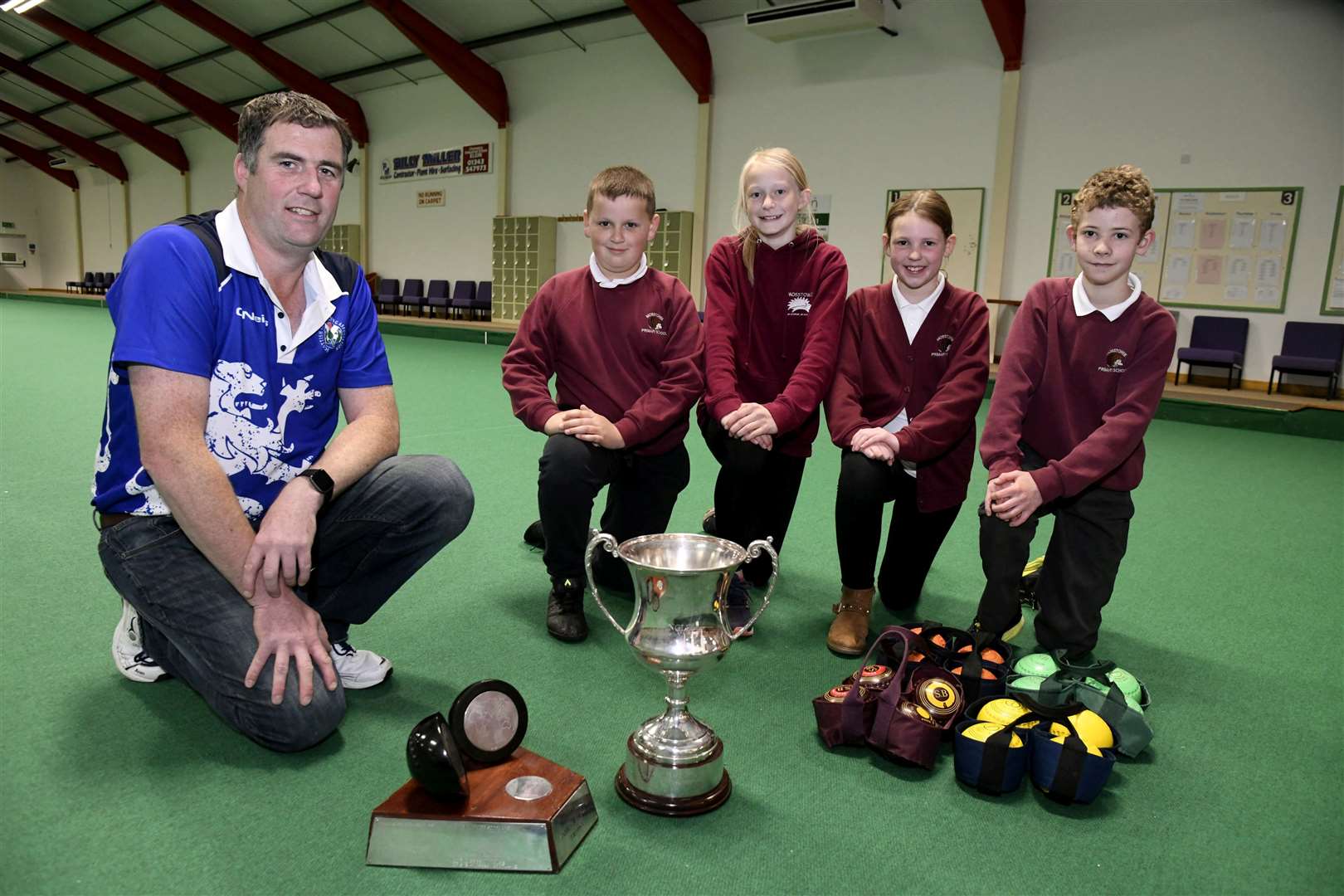 Michael Stepney, a current Scottish and World indoor bowling champion gives Mosstowie Primary pupils a lesson and shows off his trophies...Picture: Becky Saunderson..