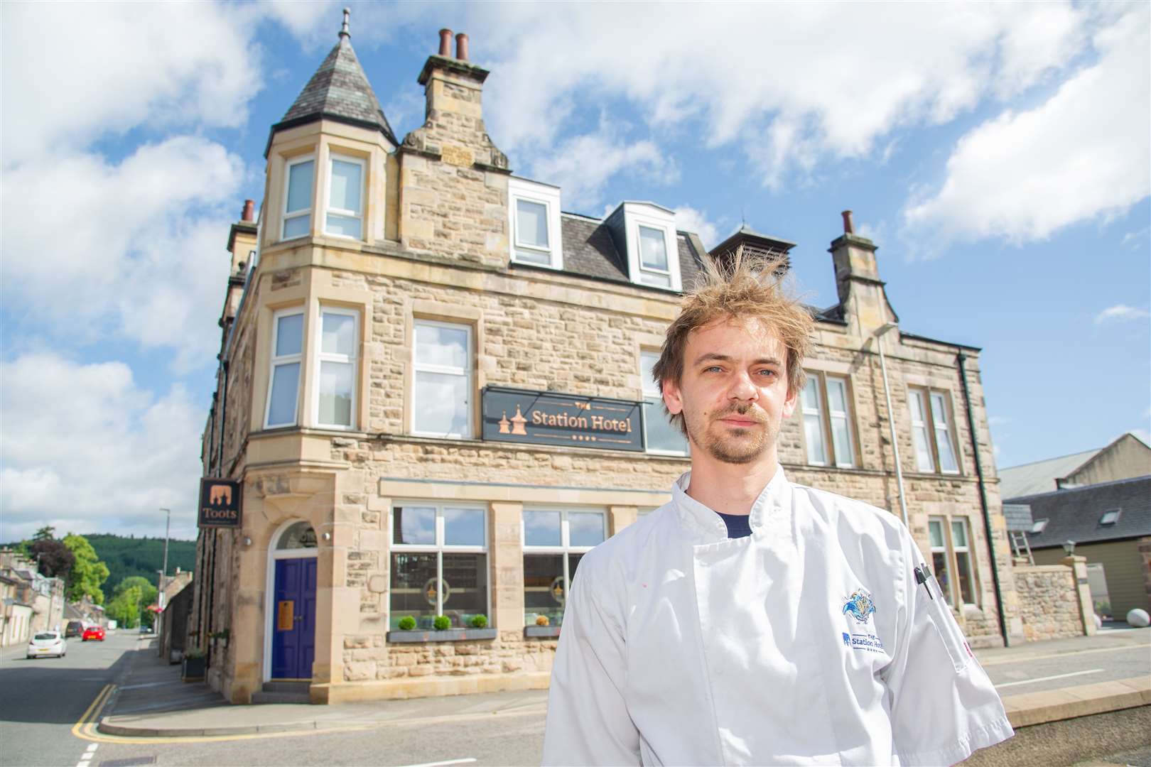 Henry outside the four-star Station Hotel at 51 New Street, Rothes.