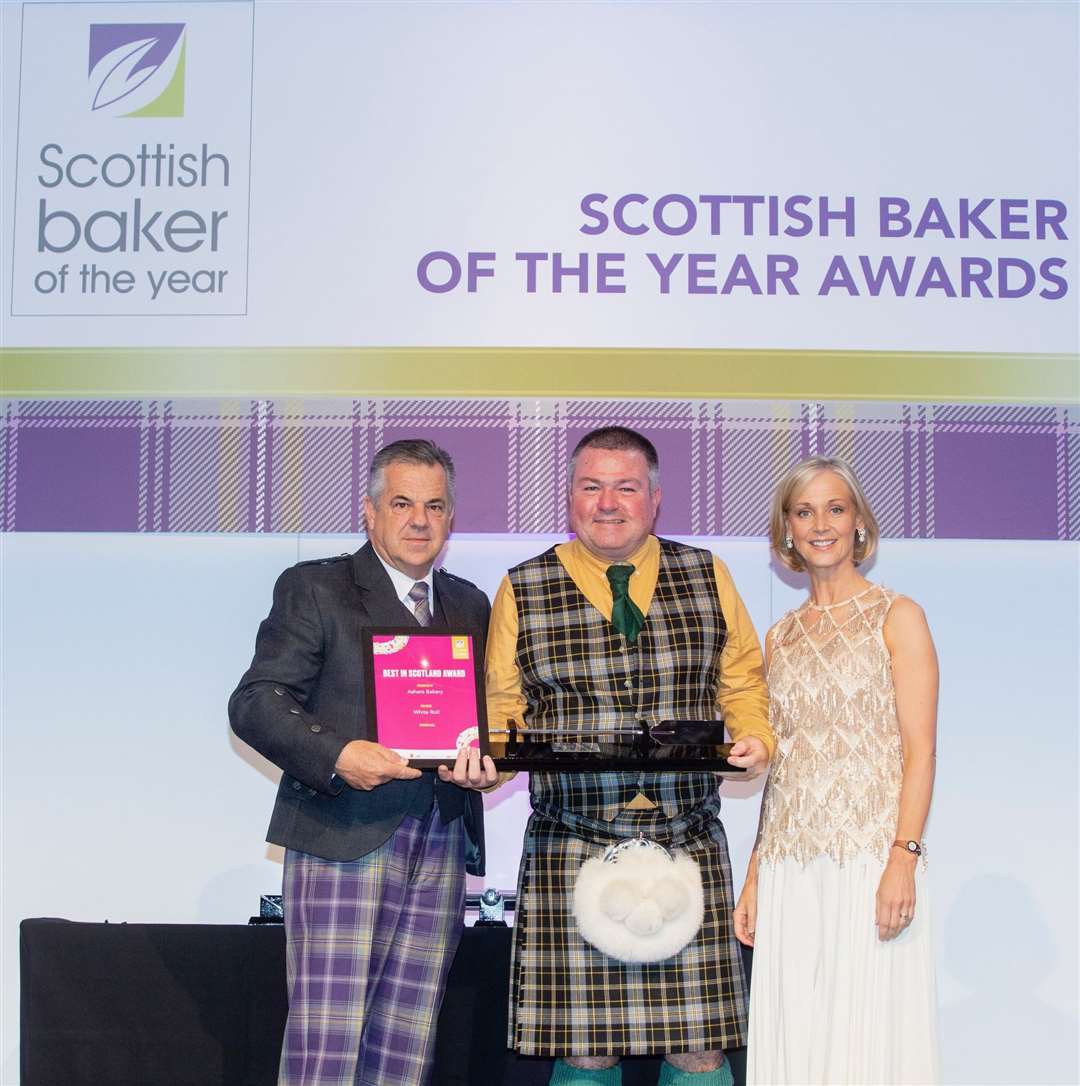 Alister Asher collects Ashers' award