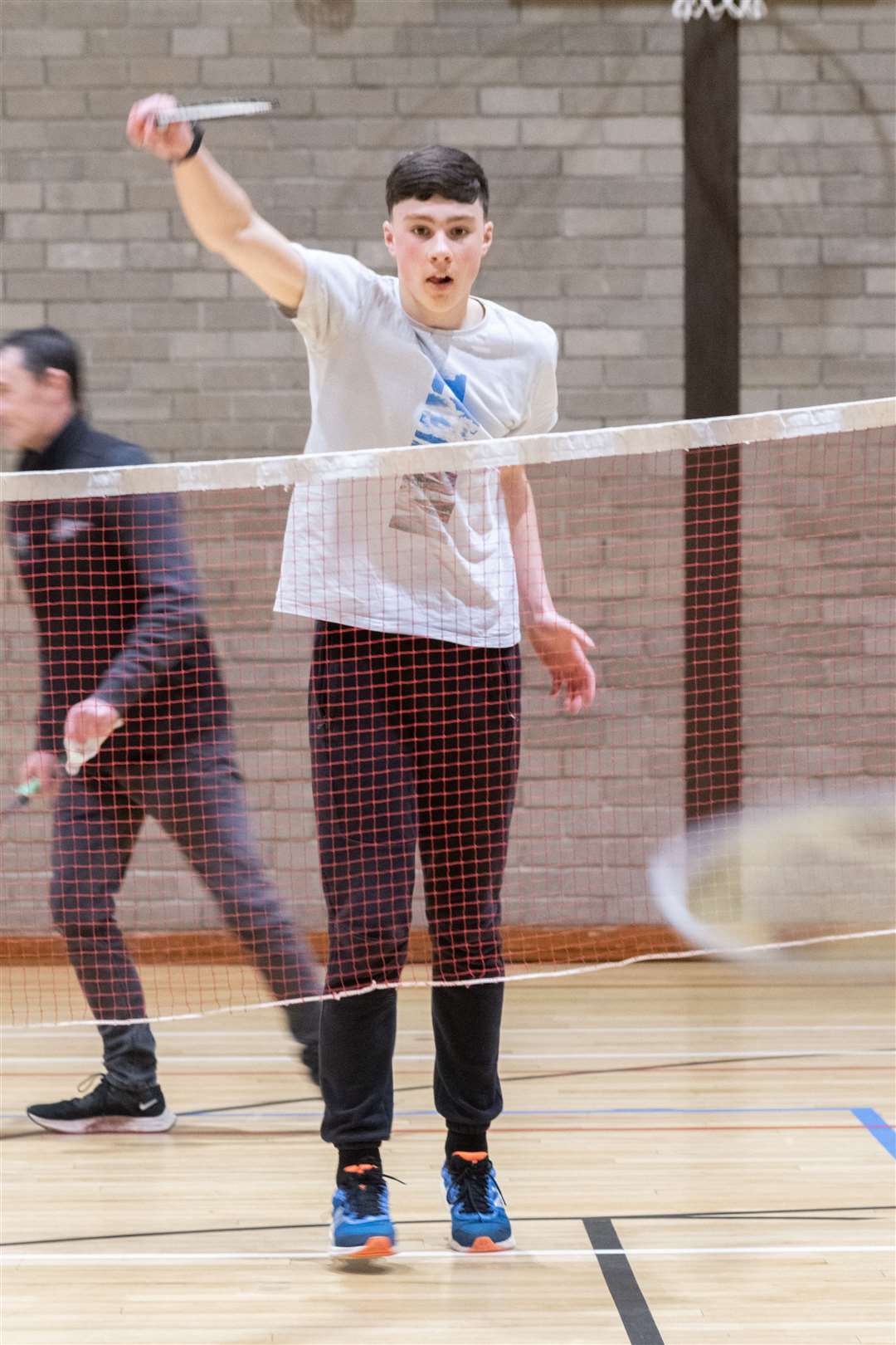 Karl Sass playing badminton.