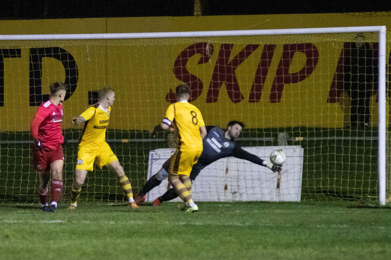 An excellent save from Forres keeper Stuart Knight denied Lossiemouth's Ross Elliot with a first half goal. ..Forres Mechanics FC (1) vs Lossiemouth FC (0) - Highland Fotball League 22/23 - Mosset Park, Forres 23/12/22...Picture: Daniel Forsyth..