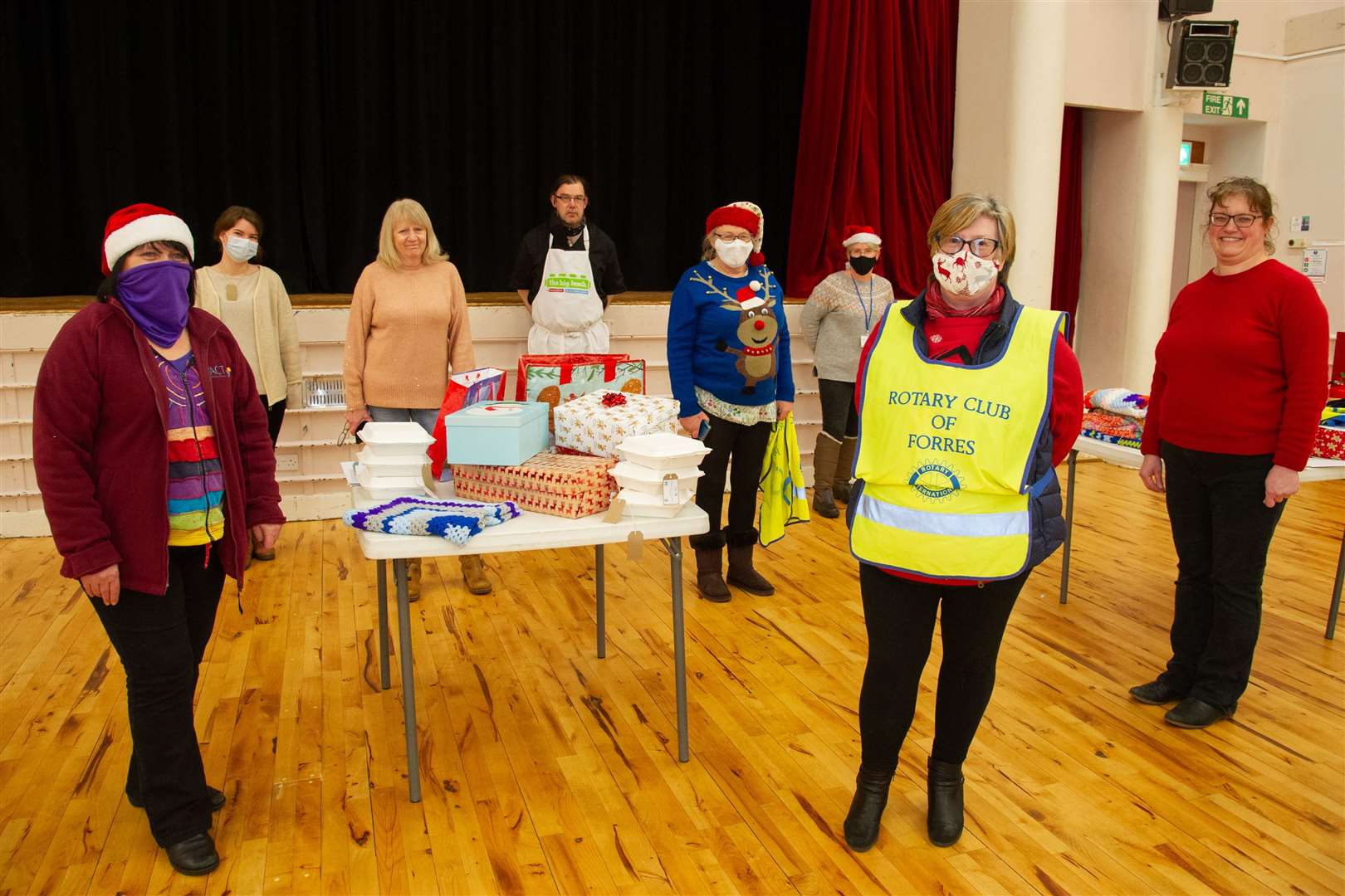Forres Area Community Trust and Rotary Club of Forres prepare to hand out tea boxes and gifts to the community.