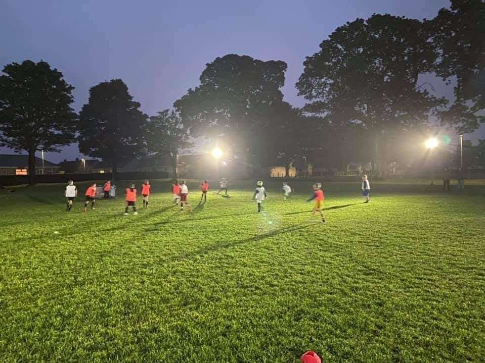 The new under-11s squad trials under floodlights at Roysvale.