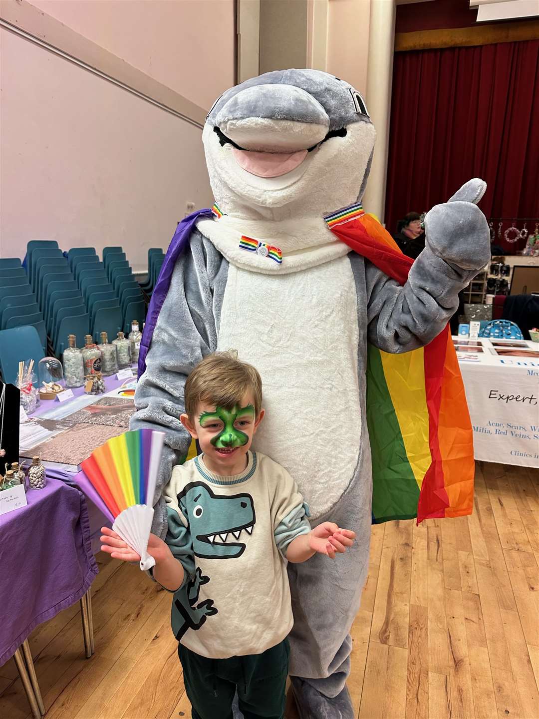 Laurence Harrison with Pride in Moray mascot Moray the Dolphin.