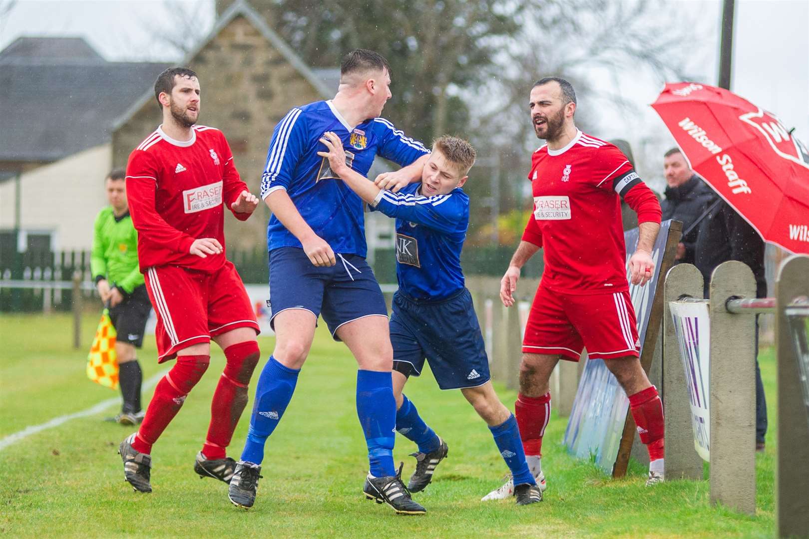 This tussle between Burghead's Lewis McAndrew and Forres' Matthew Davidson resulted in the pair getting sent off in the first half. Picture: Daniel Forsyth