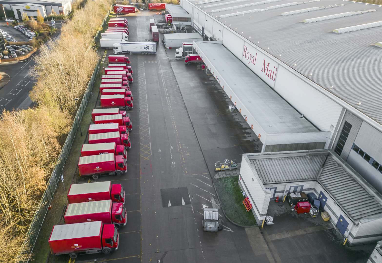 Royal Mail vehicles at Leeds Mail Centre during a strike in December (PA)