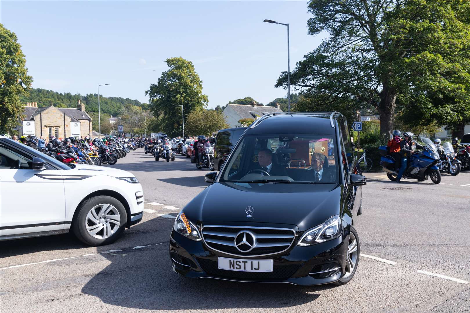 The funeral procession makes its way out of Forres. Picture: Beth Taylor
