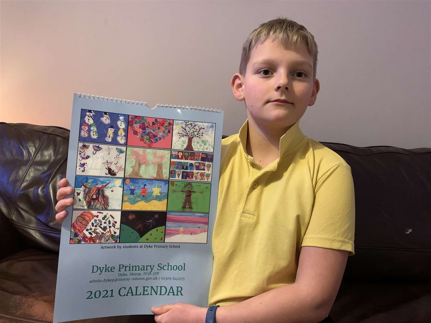 Dyke primary five pupil Tom Rhind (9) showing off this year’s school calendar.