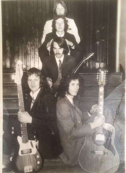 John's band Lutomer Riesling played Forres Town Hall in 1970 or 1971. He is pictured third from the back. The photo appeared in the Forres Gazette at the time.
