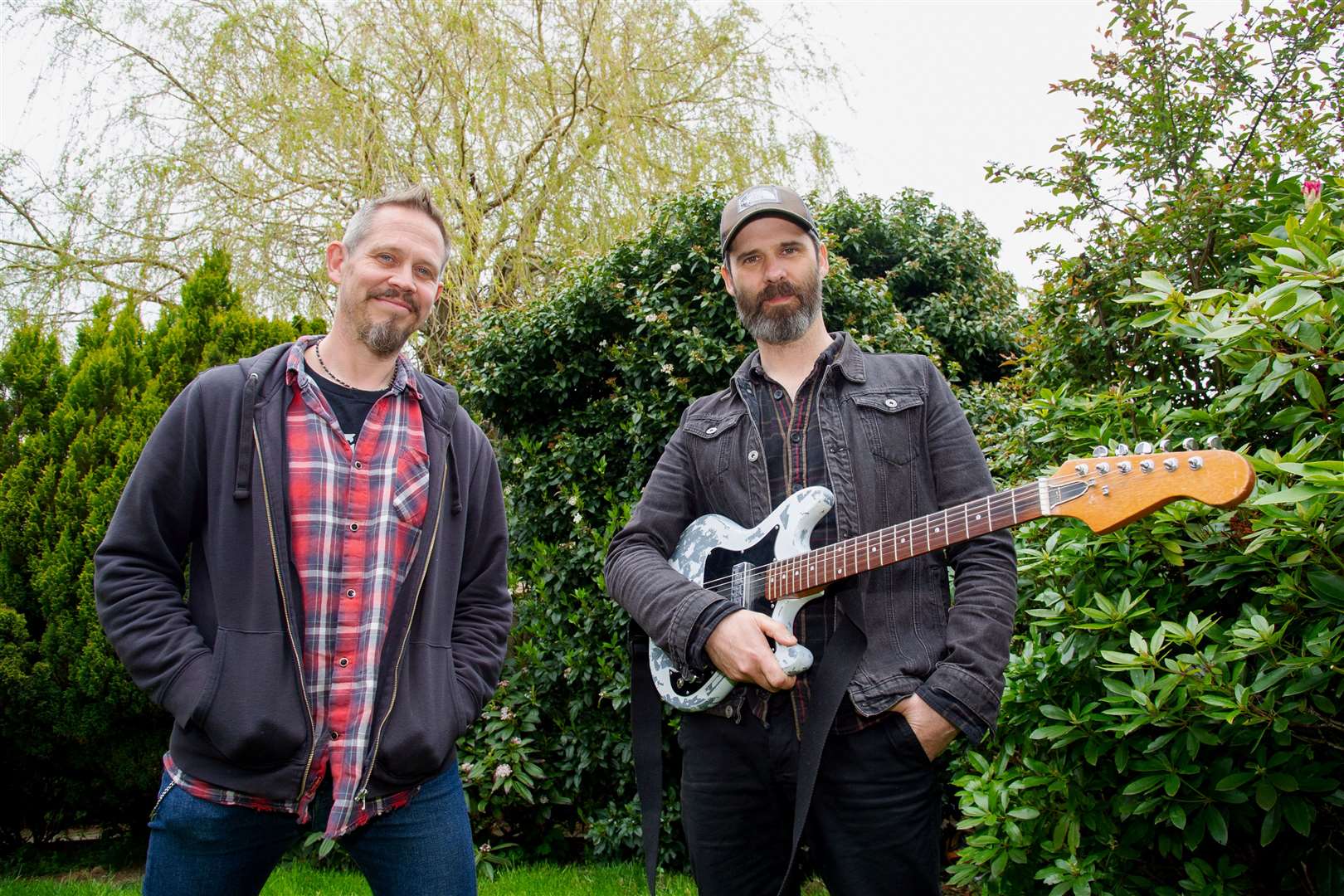 Steve Simms (left) and Dave Martin, of I Will Take You Hunting, are offering to play free, one-hour live gigs at people's homes when Covid-19 restrictions drop further. Picture: Daniel Forsyth.