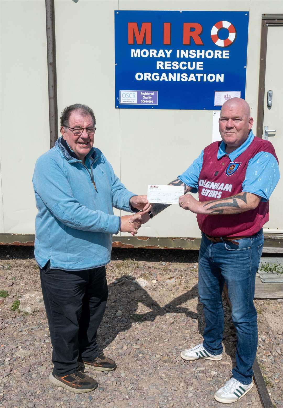 James Murdoch (right), representing the Robertson Trust and Edrington, handing over the cheque to MIRO Chairman, John Low. Photo by Morven Mackenzie