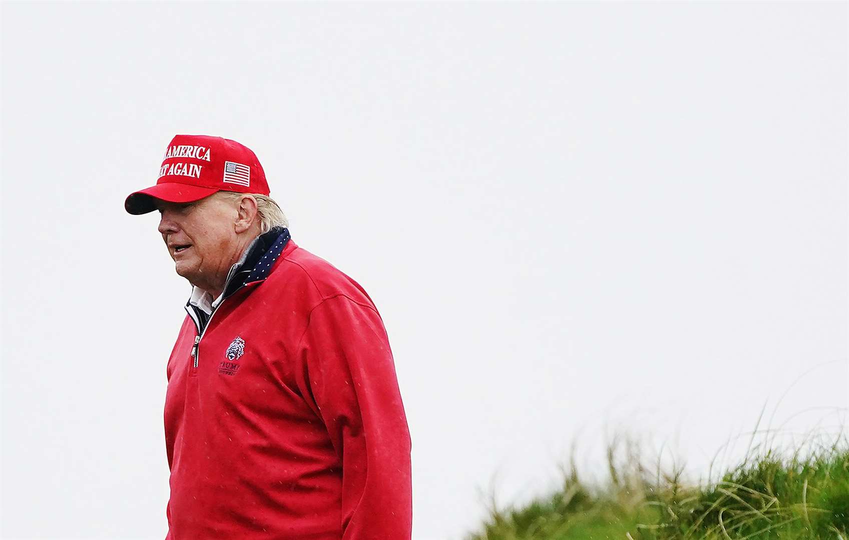 Former US president Donald Trump on the 15th green at Trump International Golf Links & Hotel (Brian Lawless/PA)