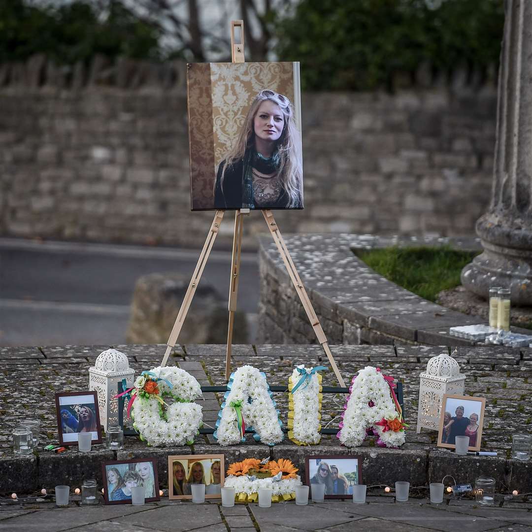 A photo and floral tributes in the Prince Albert Gardens in Swanage, Dorset, where a candlelight vigil is taking place for people to pay their respects to 19 year old Gaia Pope whose body was found nearby on November 18.