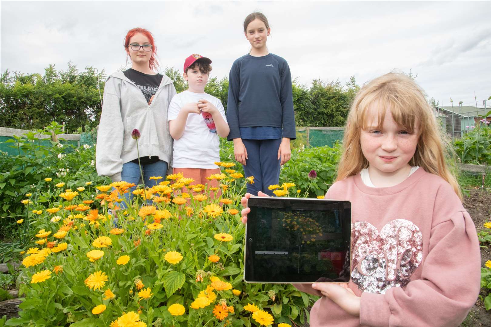 Moira Combe, Isabella Scott, Isabella Davidson and Sienna Brown during a filming workshop at Transition Town Forres. Picture: Daniel Forsyth