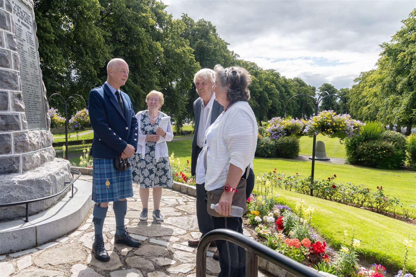 Barry Ashby and Sandra Maclennan of Forres In Bloom with the Keep Scotland Beautiful judges at Forres War Memorial.