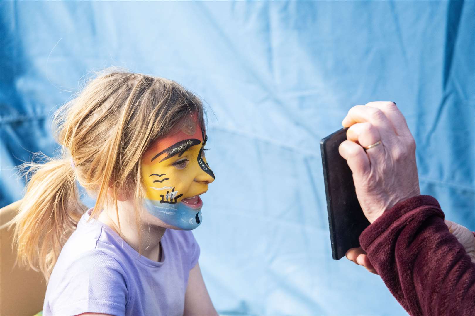 Mia McRobbie delighted with Bubbles and Co’s face painting stall. Picture: Beth Taylor