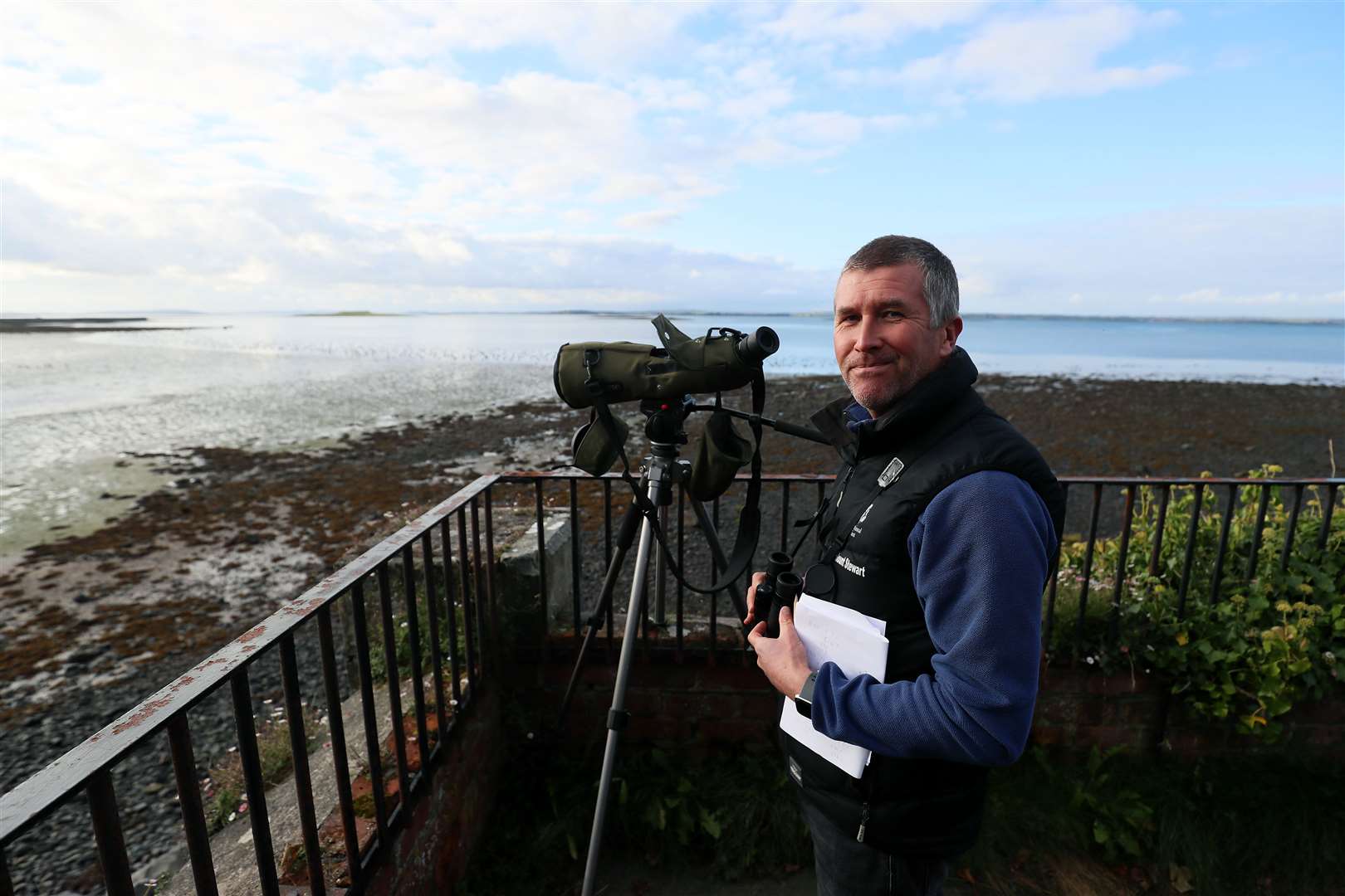 Andrew Upton, National Trust countryside manager for East Down, counts geese on the shores of Strangford Lough (Brian Lawless/PA)