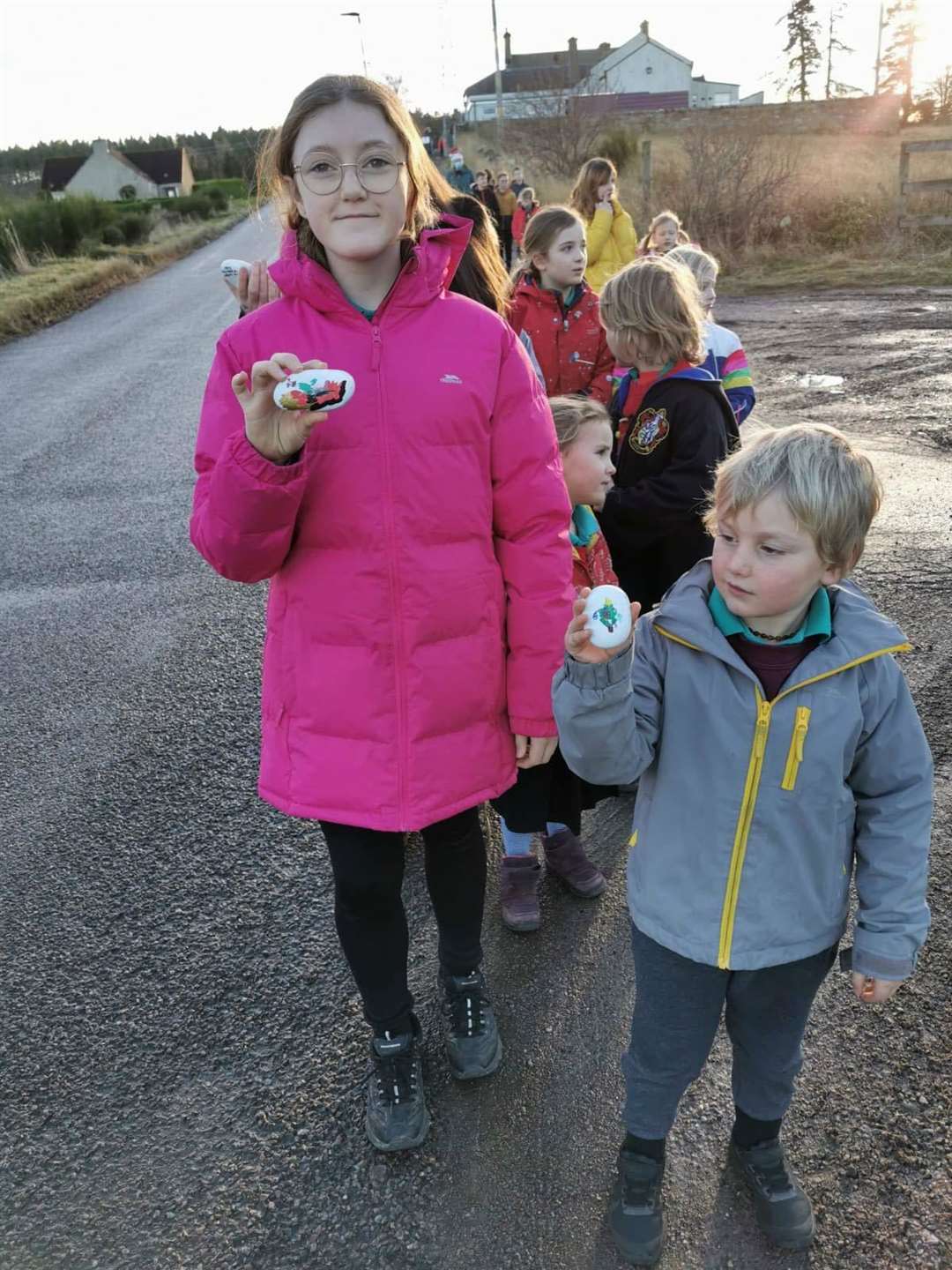 Annabel Gargaro (P7) and Tobi Lake (P1) leading the way to hand out painted stones.